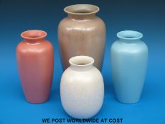 A collection of four Poole Pottery monochrome vases (tallest 26.