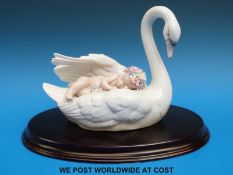 Lladro figure group of a baby asleep on a swan 'Drifting through Dreamland' in original box