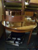 A retro G Plan extending table and six chairs