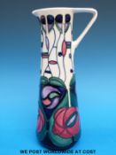 A Moorcroft ewer decorated in the style of Mackintosh (24cm tall)