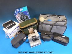 A collection of cameras to include an Olympus, Hanimex 35D, catalogues, accessories etc.
