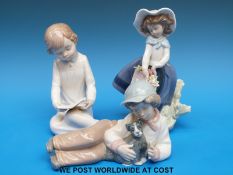 A group of three Lladro/Nao figures