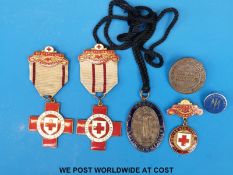 A state certified midwifery badge, together with a Plymouth 'Trained Midwife' example,