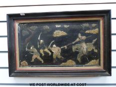 A Japanese Shibayama table top converted to a framed picture (26 x 46cm) depicting a fighting scene