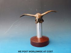 A Desmo vintage car bird mascot on stand (wingspan 17.