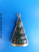 A carved jadeite Chinese pendant depicting Guanyin