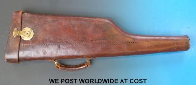 A leather leg of mutton gun case with brass lock