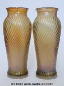 A pair Carnival Marigold iridescent glass swirl vases with flared rims (19cm tall)