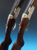 A pair of Beretta Silver Pigeon 687/3 20 bore shotguns numbered 1 and 2 with fine scrolled
