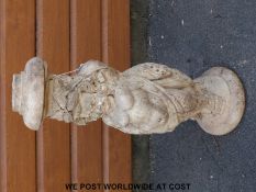 A Wills SC cherub garden pedestal in the manner of Coade stone