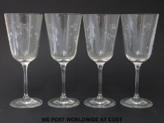 A set of four Royal Doulton wine glasses decorated with flowers (21cm tall)