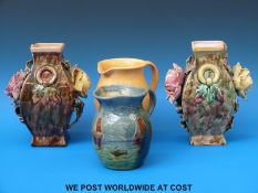 Two majolica style vases with floral and foliate overlay and two jugs