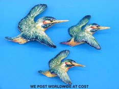 A set of three Beswick graduated kingfisher wall plaques