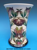 A Moorcroft limited edition (135/250) vase decorated in the Elderberry pattern,