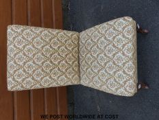 A late 19th / early 20th century upholstered nursing chair