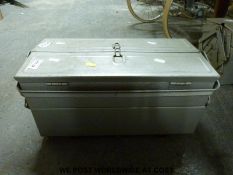 A tool box containing woodworking tools including chisels,