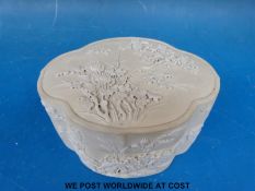 A Chinese biscuit porcelain box with applied chrysanthemums, peonies and insects (6.5cm tall, 13.