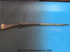 An Indian Enfield action percussion rifle with brass banding,
