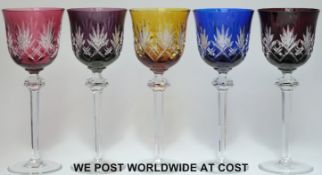 A set of five flash overlaid cut glass wine glasses raised on hexagonal stems with multi-faceted