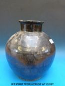 An early iron glazed jar/pot,