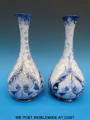 A pair of Moorcroft Macintyre Florian ware pedestal bottle vases with printed and impressed