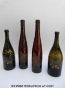 Two pairs of gilt decorated wine or spirit bottles;