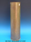 A large brass shell case,