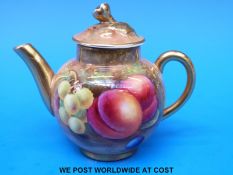 A Royal Worcester painted fruit miniature teapot signed A Shuck,