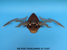 A Kit Rae Valdris double edged fantasy sword on wall stand