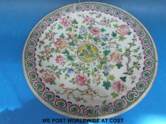 A Chinese charger decorated with chrysanthemums, prunus and foliage (34.