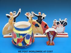 A trio of figures based on Clarice Cliff Art Deco designs,