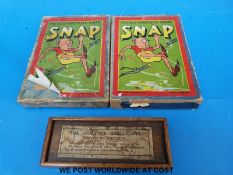A boxed ivory Spellicans game and two vintage games of Snap