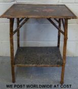 A oriental bamboo table with under shelf and decorative top (Approximately L51 x W36 x H69cm)