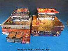 A collection of Warhammer role playing games and playing cards together with a quantity of