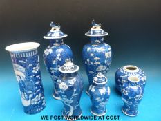 Two 19thC Chinese prunus vases with lids, a Chinese prunus cylindrical vase,