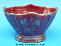 A Richard Ginori burgundy pedestal bowl with silver lustre decoration (7.