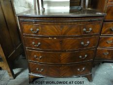 A small bow fronted chest of four graduated drawers with brush slide (W76 x D50 x H77cm)