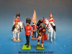 A quantity diecast British soldiers by Britains to include Guardsman, examples on horseback,