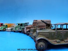 Sixteen Dinky Toys diecast model vehicles together with various accessories including petrol pumps,