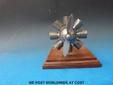A radial aero engine vintage car mascot with moving propeller length 14cm,