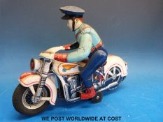 TM Toys (Japan) tinplate police motorcycle and rider, Pat No 472797,