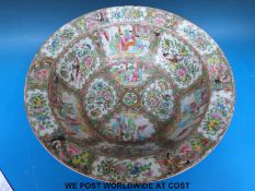 A large Chinese famille rose planter decorated in sections depicting figural scenes and floral and