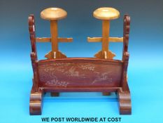 Two Kabuto stands and a two tier sword stand