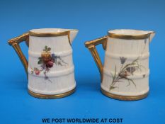 Two c1900 Royal Worcester barrel shaped jugs hand painted with flowers (both 6.