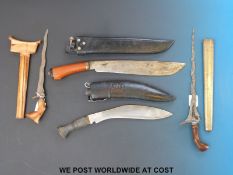 A kris wavy bladed dagger with carved possibly fruitwood handle, another kris,