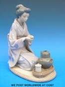 A Lladro figure of a Japanese lady making tea (22cm tall)