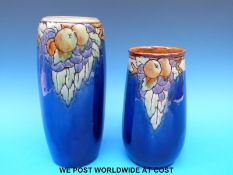 Two Royal Doulton stoneware vases with apple and grape decoration to the rim (tallest 26cm)