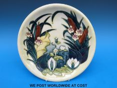 A Moorcroft charger decorated in the Lamia pattern (26cm diameter)