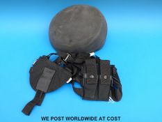 A special ops style helmet and a canvas shoulder holster for a pistol and magazines