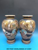 A pair of Japanese Satsuma vases decorated with immortals (32cm tall)